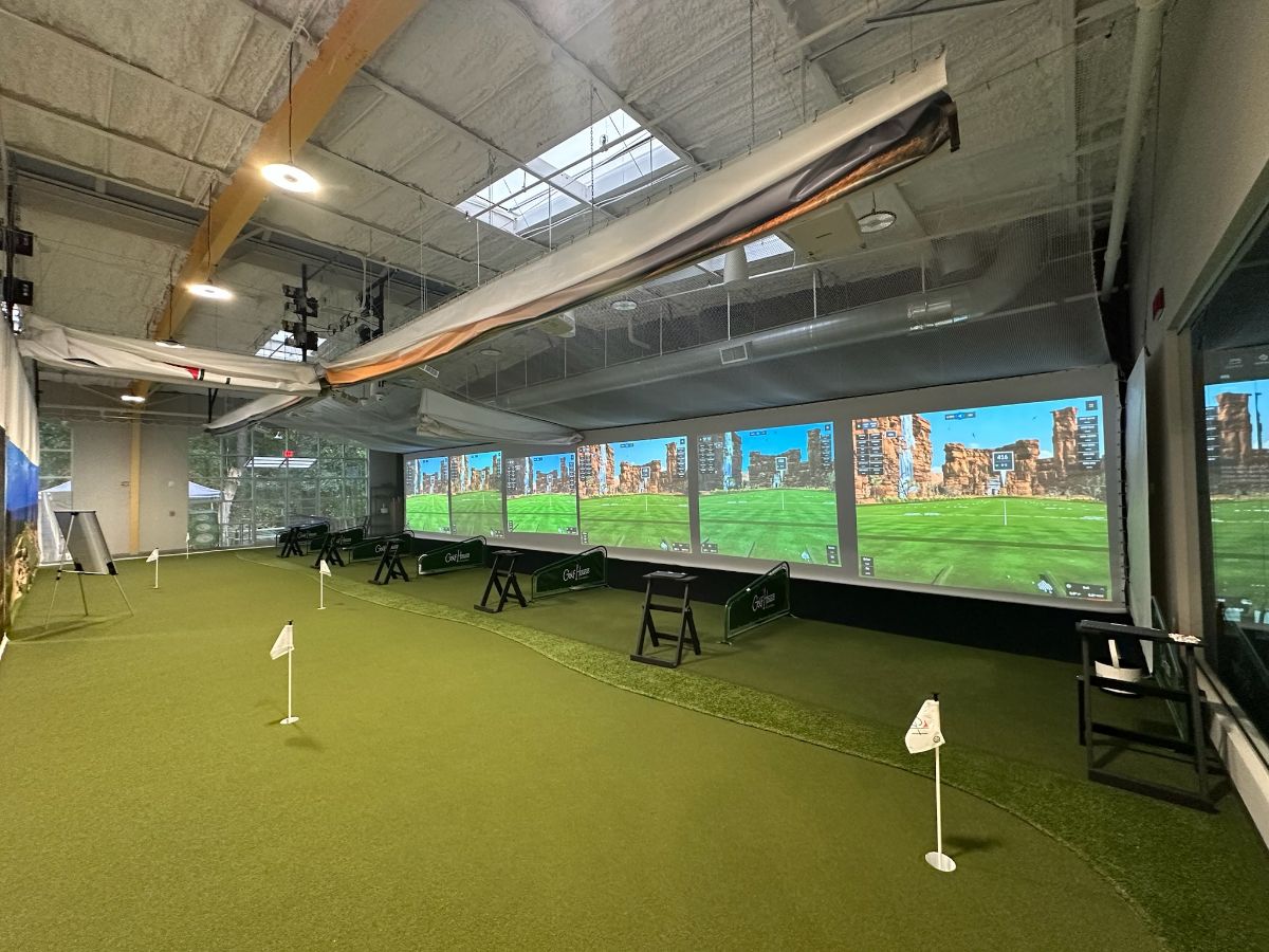 Golf simulators set up for a company retreat