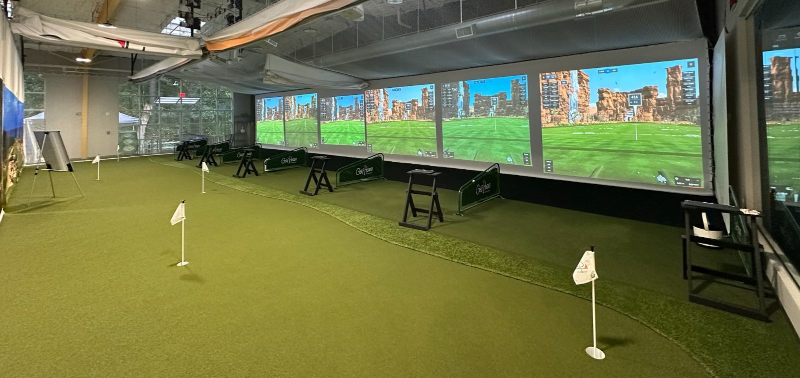 Indoor golf bays at Golf House Academy in Atlanta